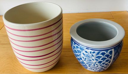 2 Ceramic planting pots. Stripe one is 7 1/2” tallX 6 1/2” diameter.