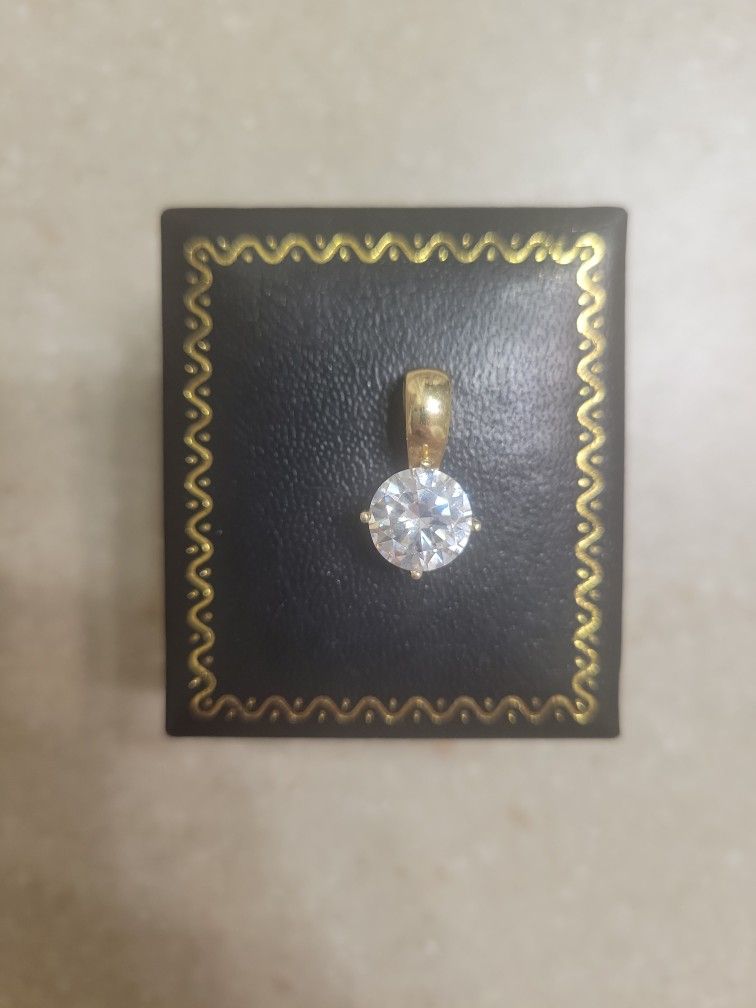 14 K Gold Pendant With CZ. Weight Is 2.7 Grams