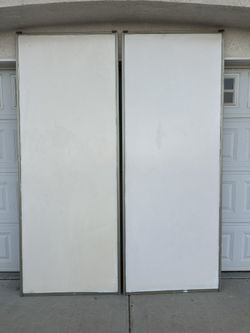 Two Sliding Closet Doors ,missing wheels each dimensions : 36”x 95”(H) In good condition