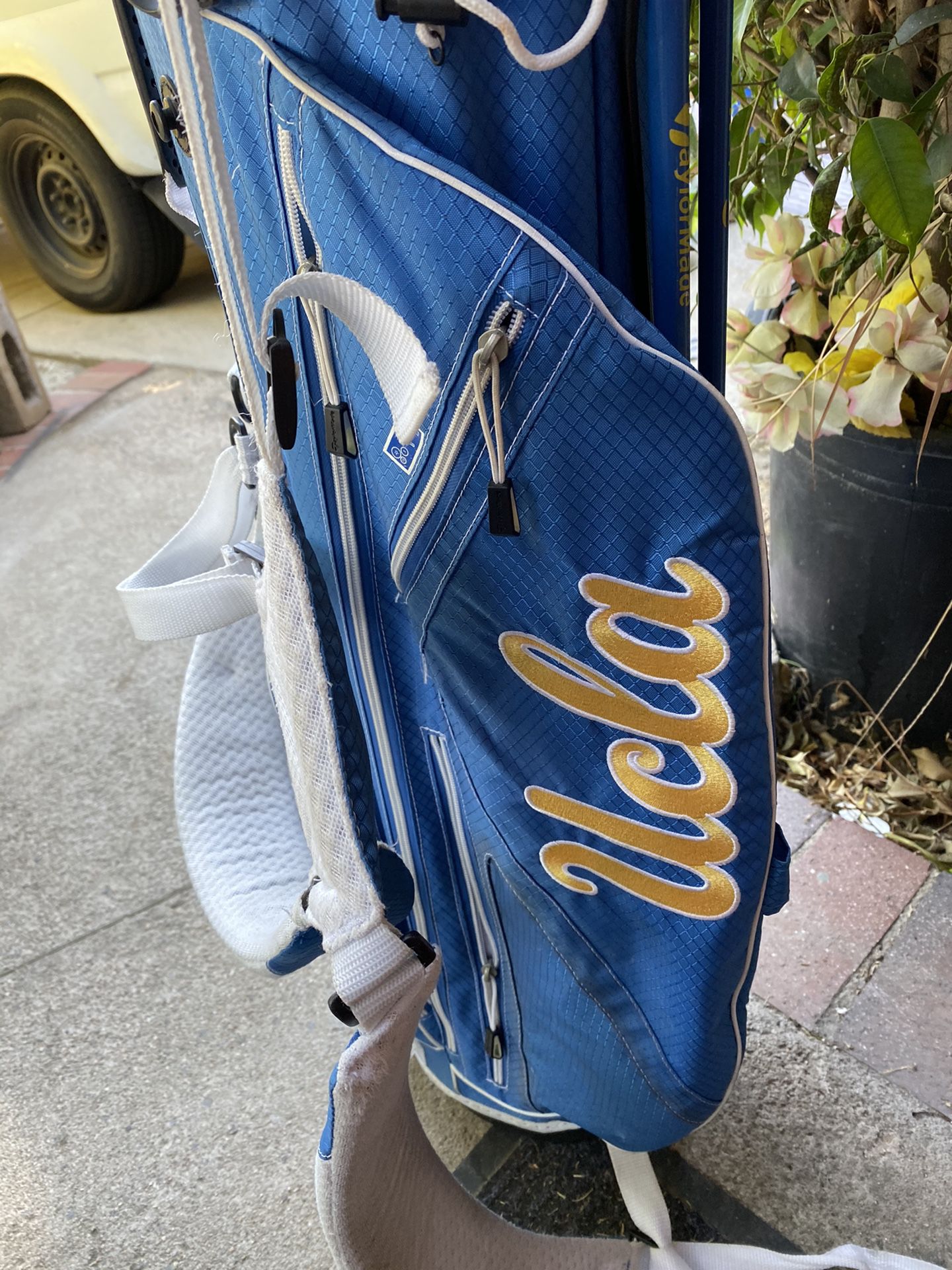 UCLA golf bag and clubs