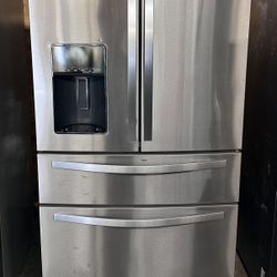 Whirlpool brand refrigerator with 4 doors made of stainless steel