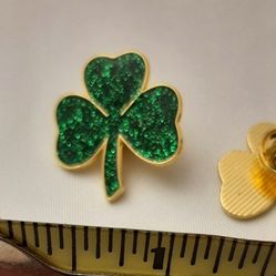 Sparkling green glitter look shamrock pin.