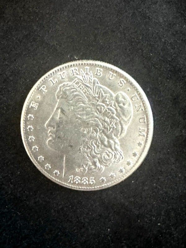 1885 CC Morgan Silver Dollar. Looks ALMOST UNC. Nice Coin For A Collection.