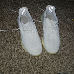 Size 12  Adidas Yeezy Boost 350 V2 in the "Triple White" colorway. 
