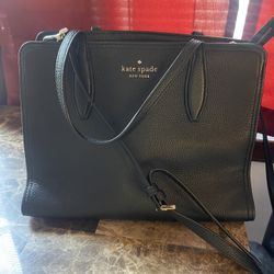 Kate Spade satchel purse with gold accents, handles/strap,