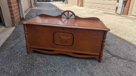 Vintage cedar chest with wagon wheel design