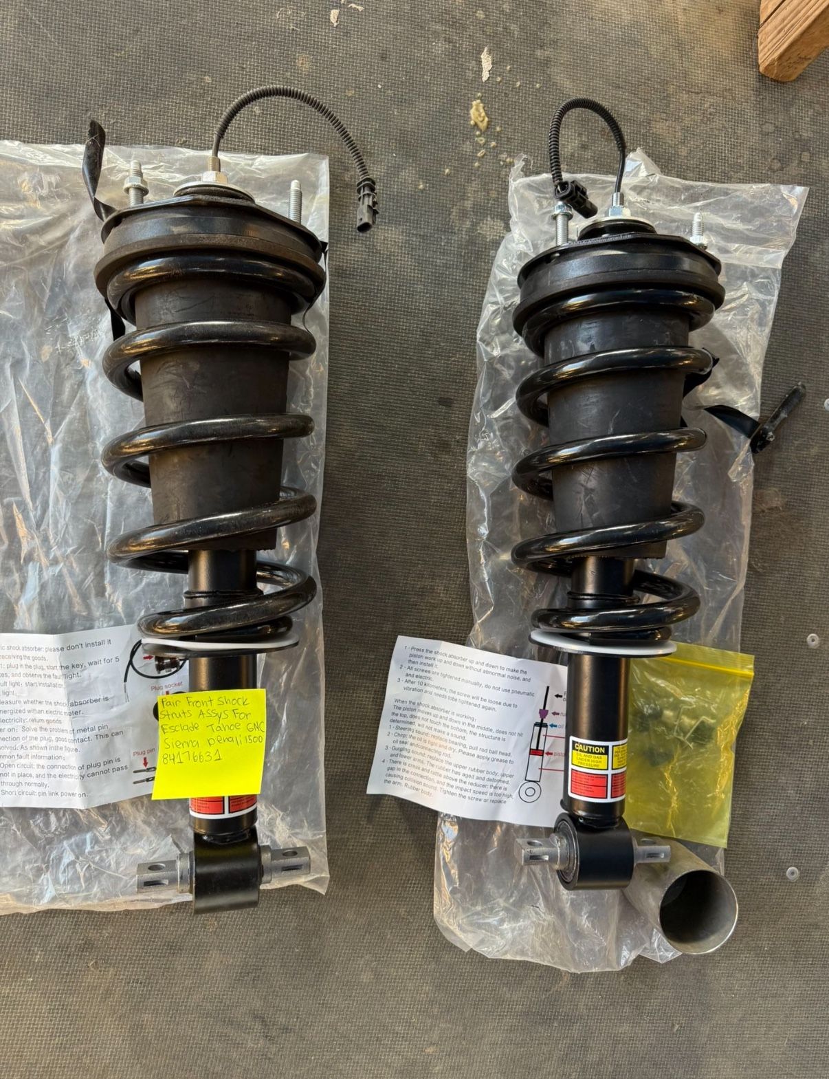 Front pair shock struts assys