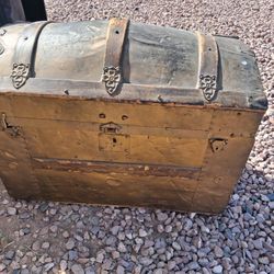Antique camel back or dome-top steamer trunk. These types of trunks were popular in the 19th and early 20th centuries as luggage for travel by ship or