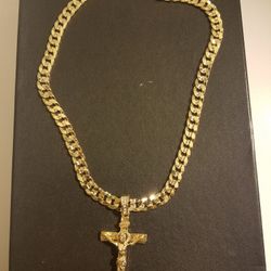 14k gold filled cuban chain, with jesus on cross pendant.
