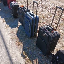 LOTS OF NICE PULL ALONG LUGGAGE 