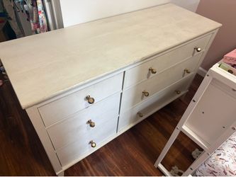 Dresser with gold knobs