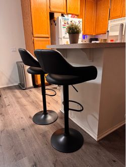 Two adjustable bar stools