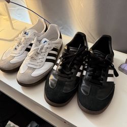 Black and white pair of adidas Sambas