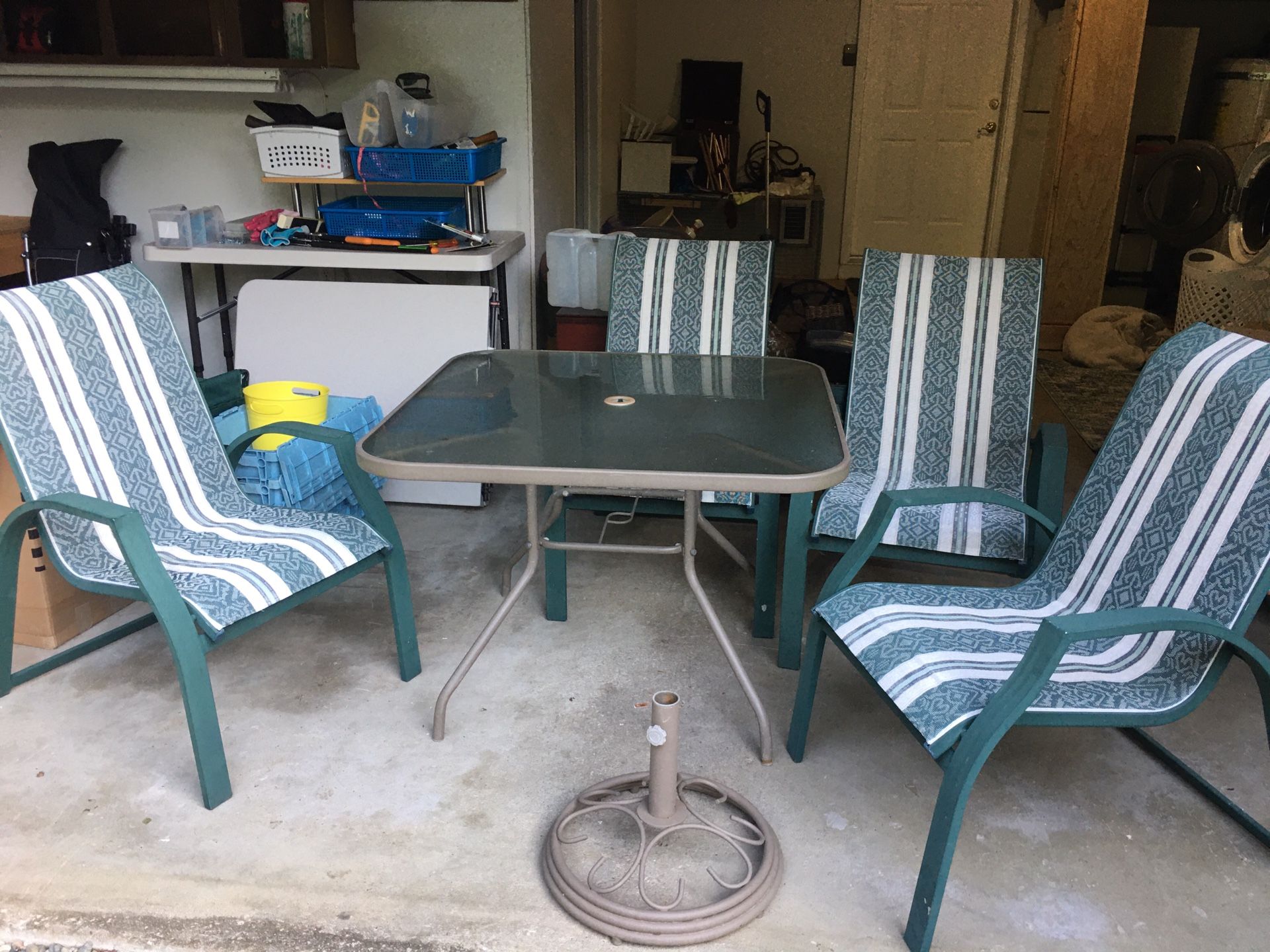 Patio Table and four chairs and umbrella stand