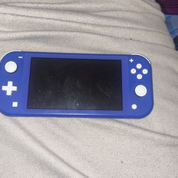 Nintendo Switch Lite + A Charger For The Switch