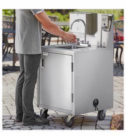 Portable sink with heated water pump