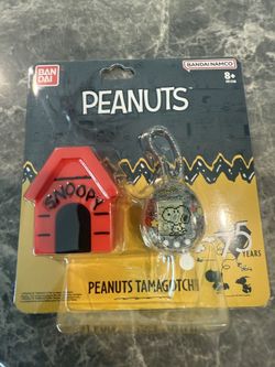 SDCC 2025 Tamagotchi Peanuts Snoopy Bandai Namco Exclusive In Hand