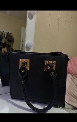 Black purse with gold details