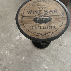 Pier 1 Vintage-Inspired Wine Bar Accent Table featuring a round wooden top with "Private Reserve" text and an iron base