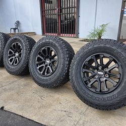 17" Ford F150 Raptor OEM rims w- 33" Cooper AT tires. $1600