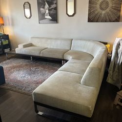 Modern low back sofa with built in end table. Dellarobia Sodeo.