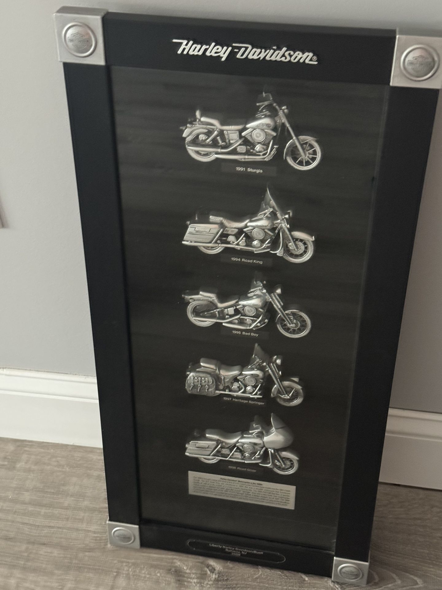 This is a 2008 Harley-Davidson Motorcycles of the 1990s shadow box display.