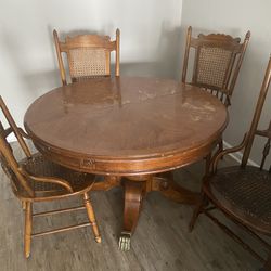 Antique solid oak claws table with chairs