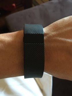 Fitbit Charge HR. Small. Used with wear and scratches. Comes with charger. Holds a day charge.