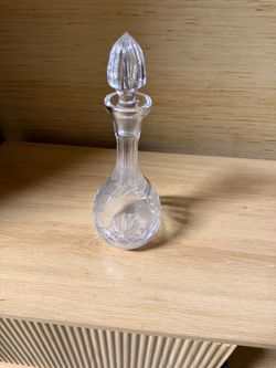 vintage cut-glass/crystal decanter with a decorative faceted