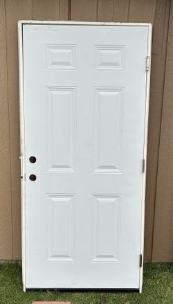 Puerta para exterior con marco de metal 36x80 Nueva $300 dlls  Estoy en northeast