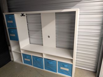 White TV stand with storage cubbies