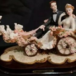 Casinelli statue of bride and groom in dove led carriage