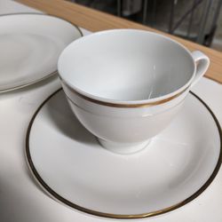 Set Of White China With A Gold Rim