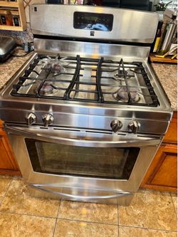 Kenmore 4 burner gas stove, stainless steel top