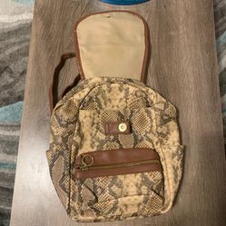 Snake skin print & brown leather backpack