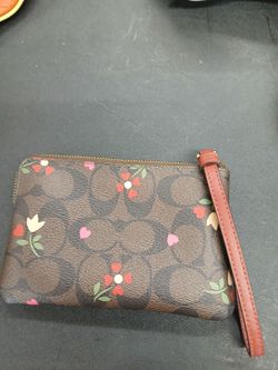 A coach very tiny handpurse