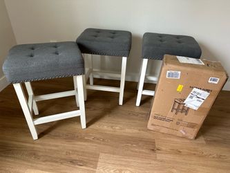 4- barstools 3 used and 1 brand new tufted stool