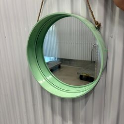 Round mirror, teal in color 18” diameter. .. ready to hang ..$40