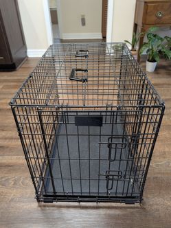 Small metal dog crate with removable bottom tray