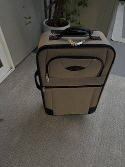 Small brown carry on suitcase