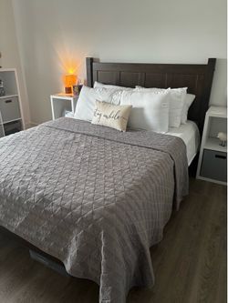 Queen sized wood bed frame with mattress