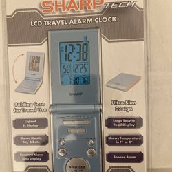 Sharp LCD travel alarm clock. 