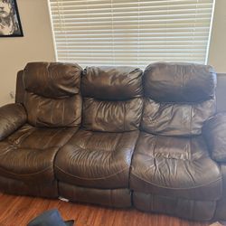 Brown leather reclining sofa