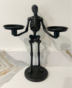 Black metal skeleton candelabra