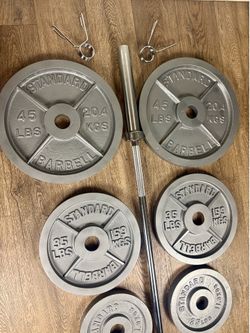 Full set of CAP Gray Olympic Weight Plates in NEW Condition & Brand NEW 6 ft Bar Steel Bar With Cooper Bearings [ Total 287 lbs].