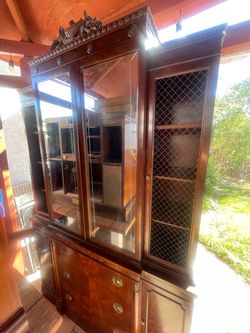Antique mahogany breakfront china cabinet