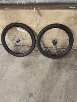 Set of 20 inch tires and front and back rims .