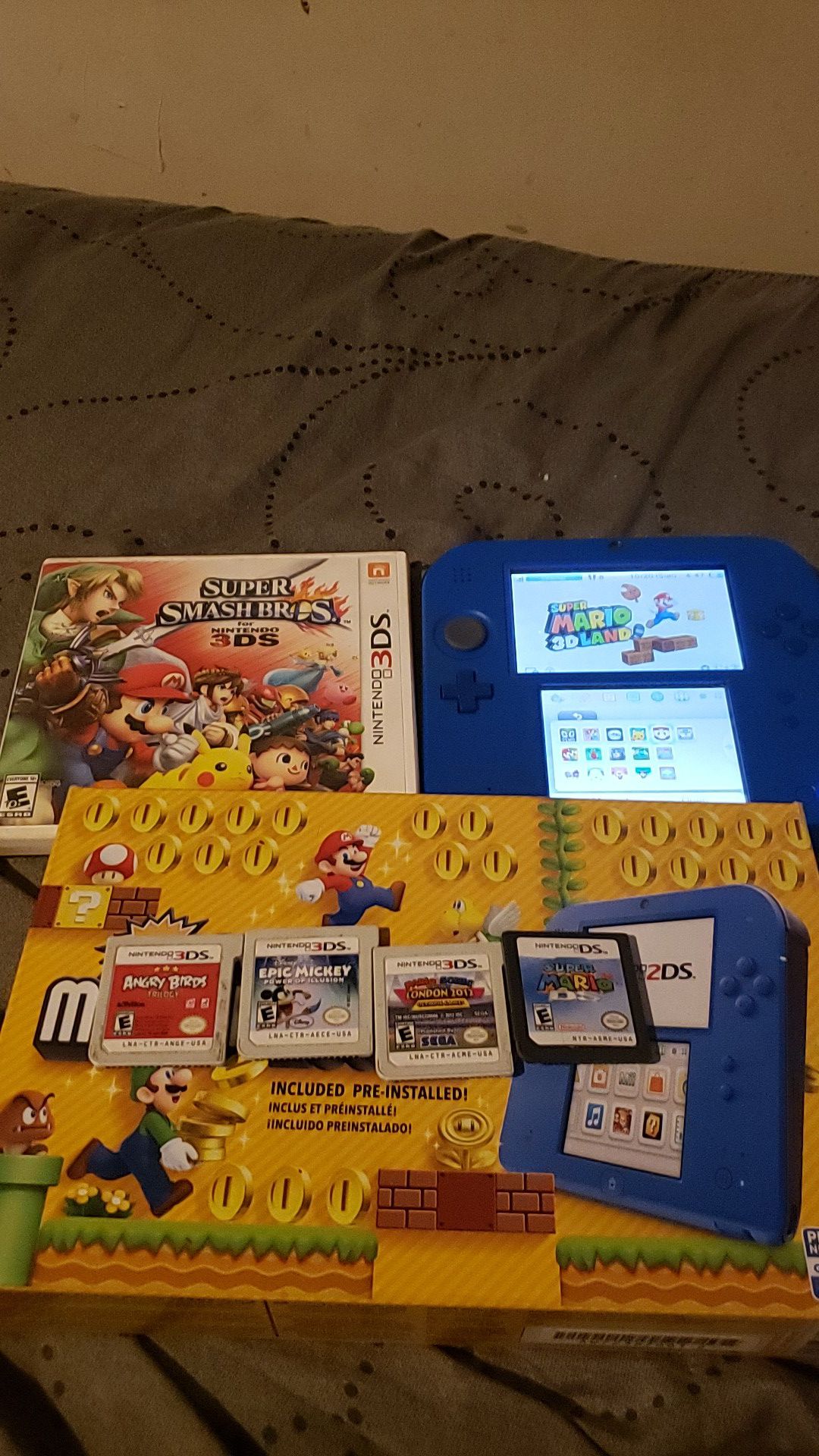 Nintendo 2ds with 20 games, charger, and box