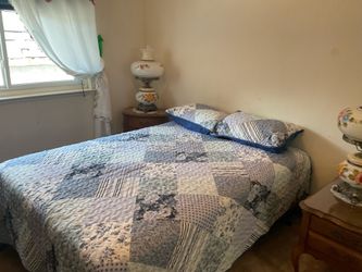 Twin bed with two side tables and lamps