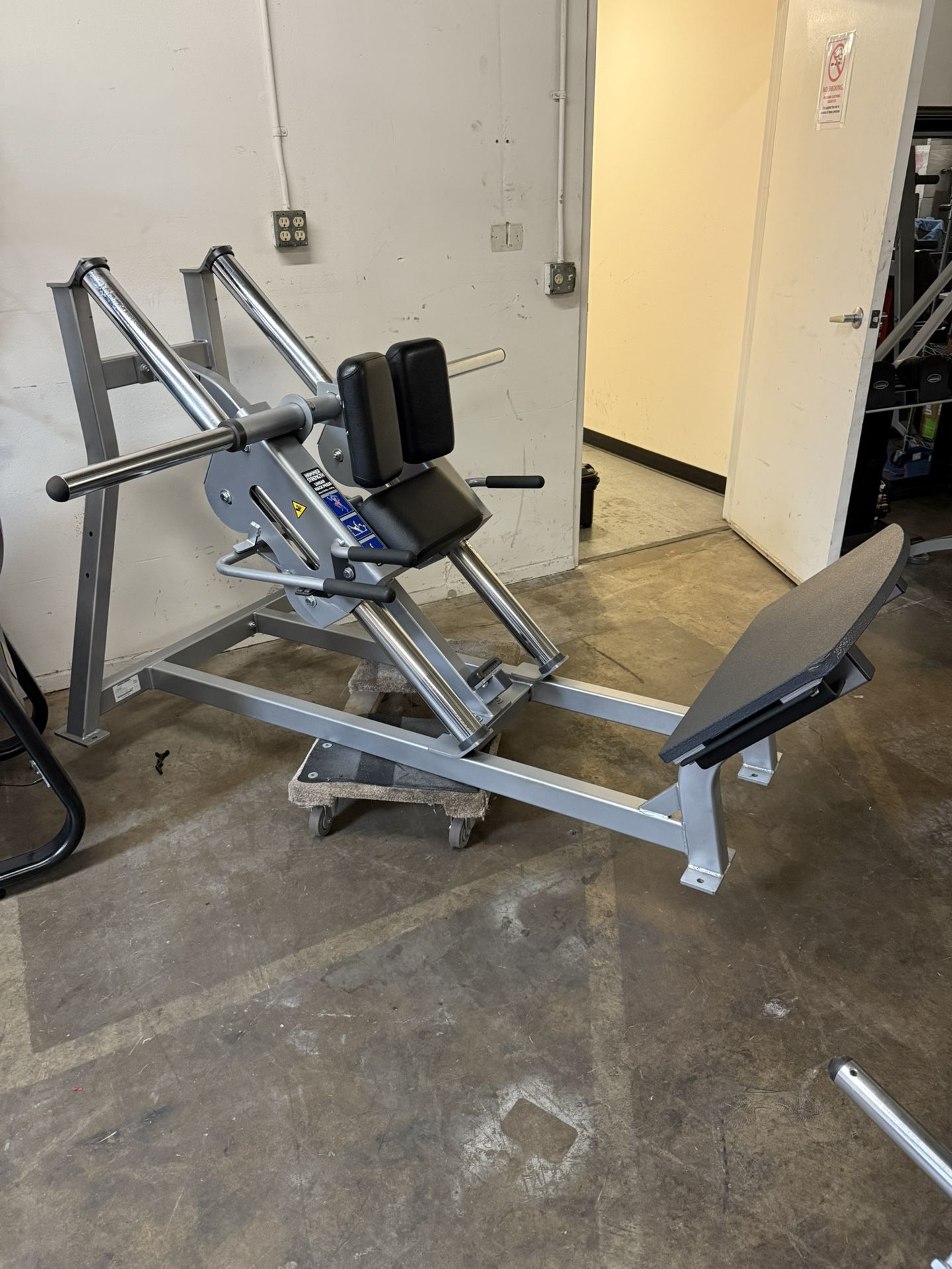 Hammer Strength Plate Loaded Linear Hack squat machine, commercial gym